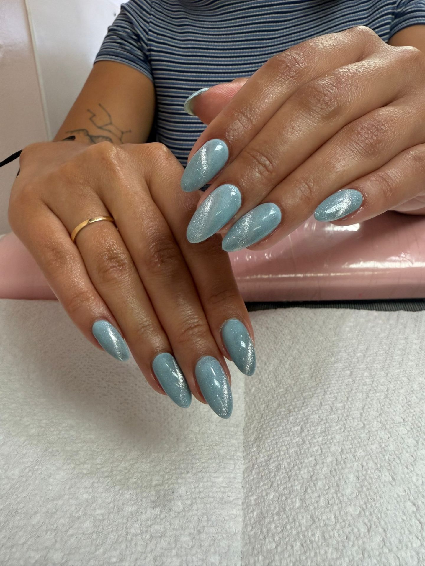 Sky blue cat-eye almond nails